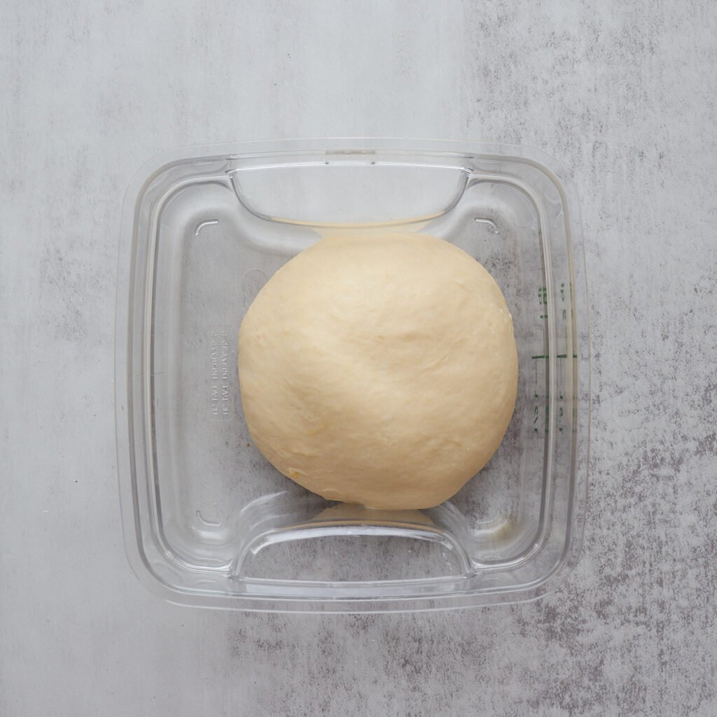 Dough for Sourdough Cinnamon Star in a square container before first rise.