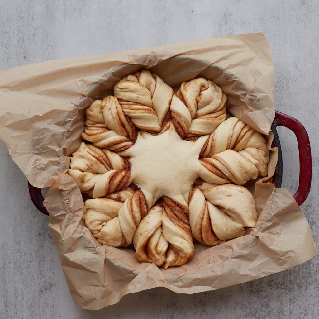 Sourdough cinnamon star bread in a bread oven for second rise.
