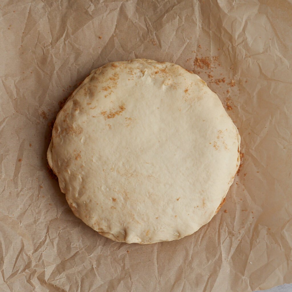 Final later of sourdough cinnamon star bread dough placed on top of the dough and cinnamon sugar layers.