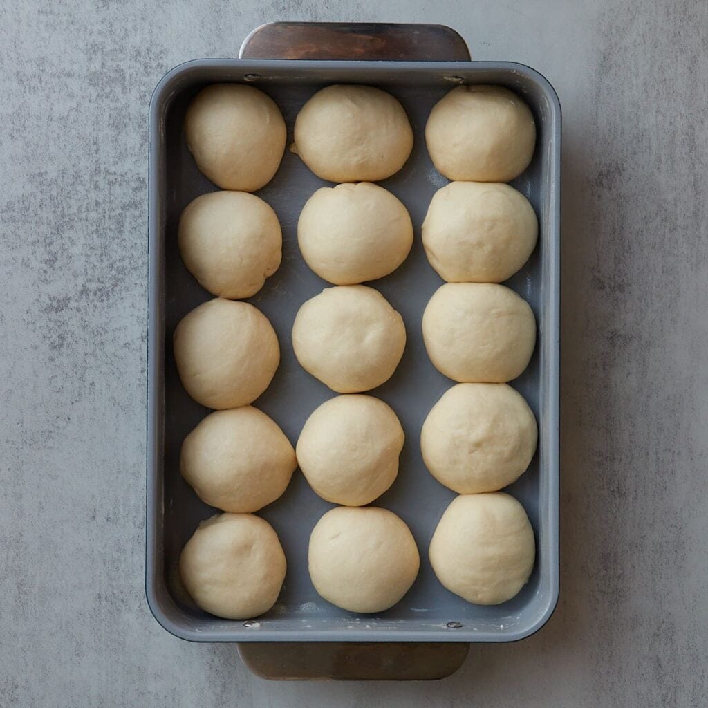 Sourdough Discard Dinner Rolls after rising in a 9x13 pan.