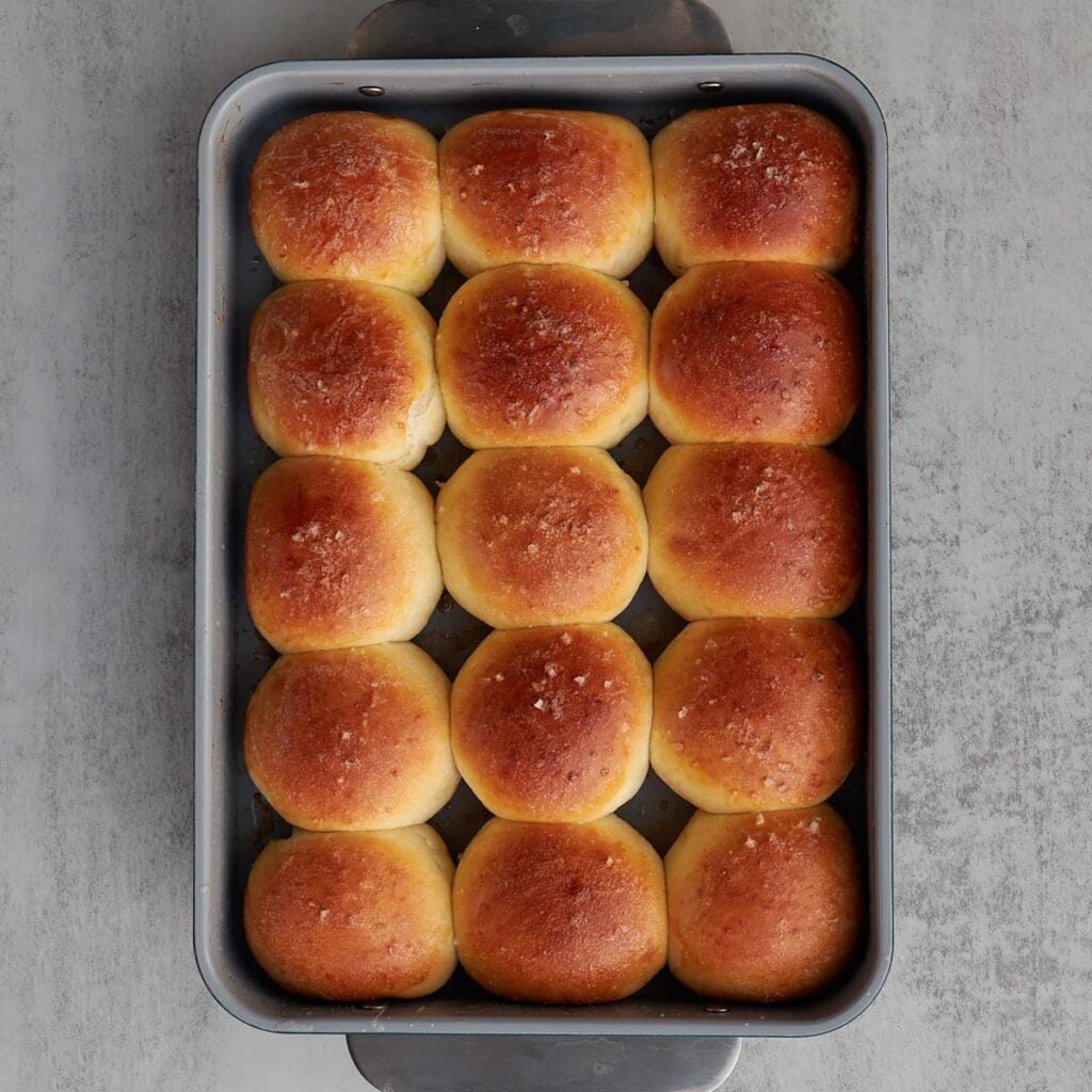 Sourdough Discard Dinner Rolls freshly baked in a 9x13 pan.