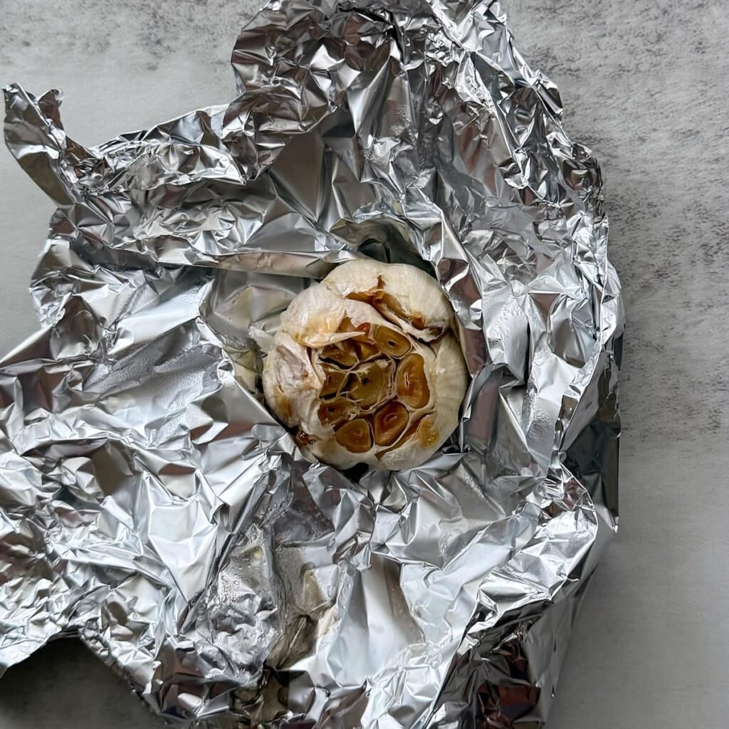 Roasted garlic inside of a piece of foil.