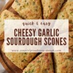 garlic scones arranged on round wooden tray.