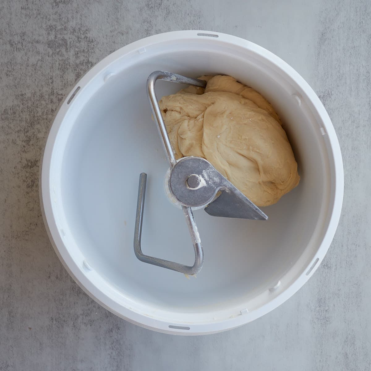Discard hamburger bun dough in a Bosch mixer.