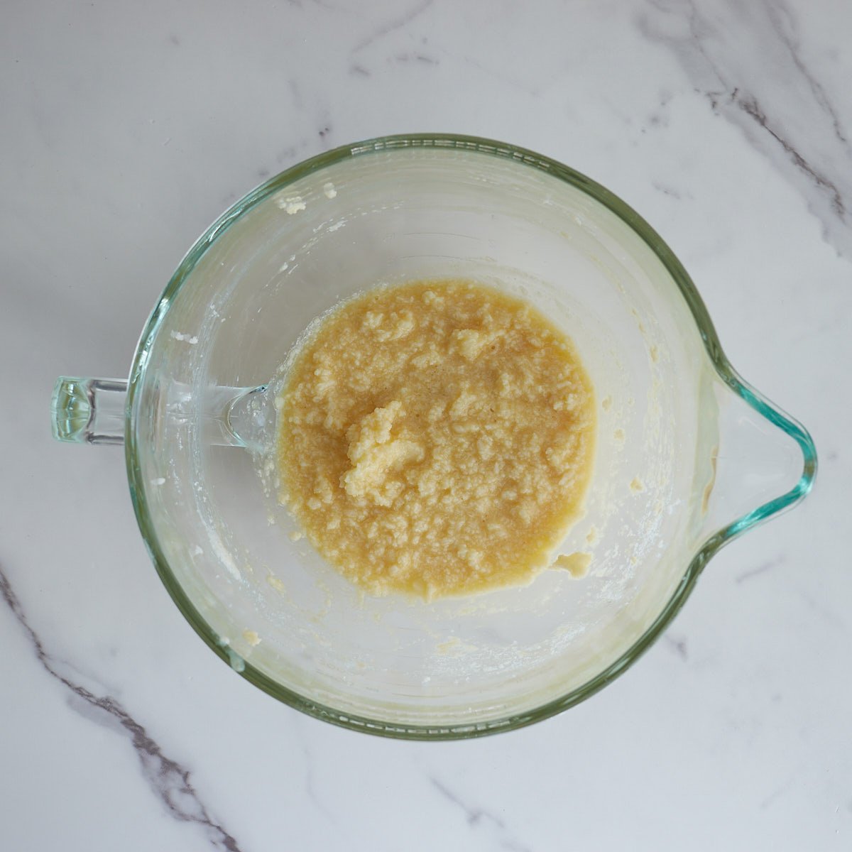 Remaining wet ingredients mixed with creamed butter and sugar in a large glass bowl.