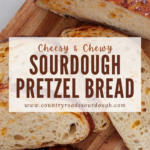 A pinterest pin of cheesy sourdough pretzel bread sliced and arranged on a wooden cutting board.