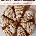 7 Sourdough Carrot Cake Scones arranged in a circle on a round wooden board.