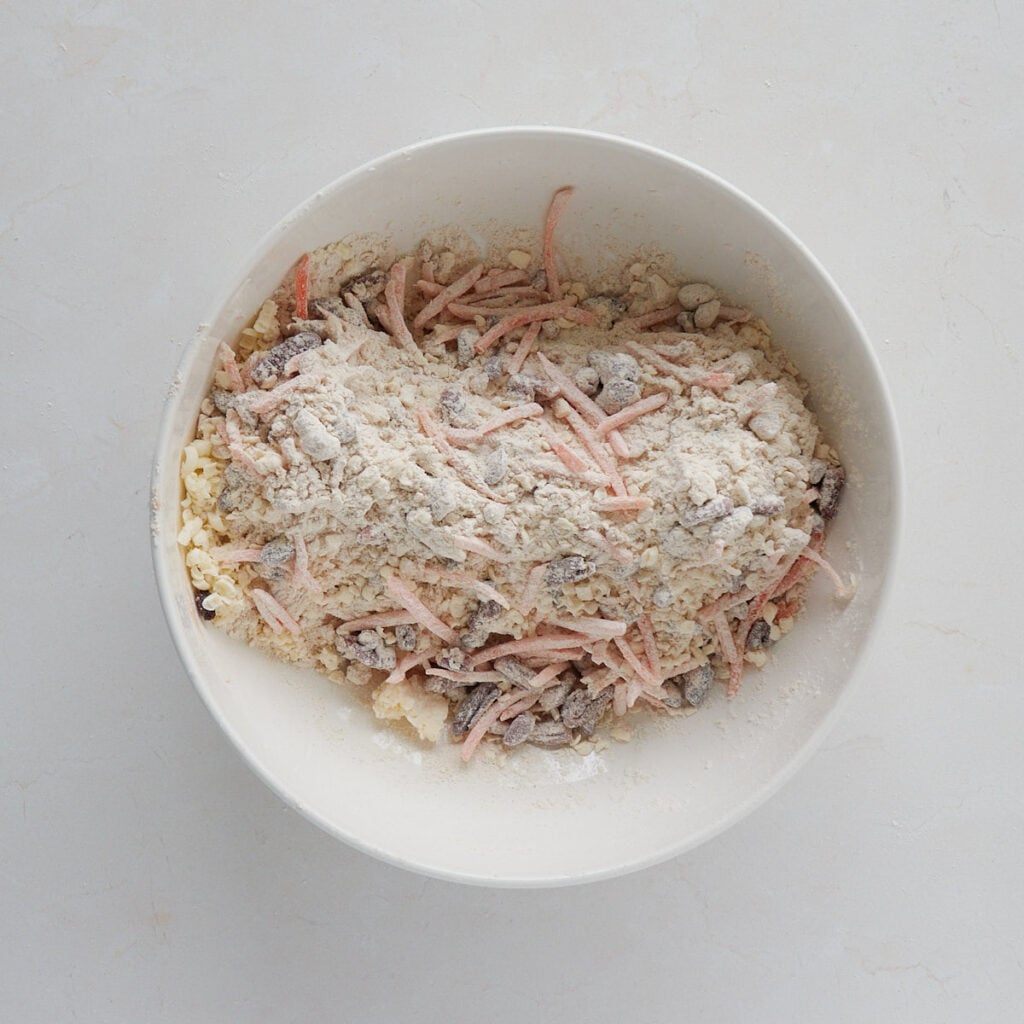 Carrots, raisins and pecans added to dry ingredients for sourdough carrot cake scones.