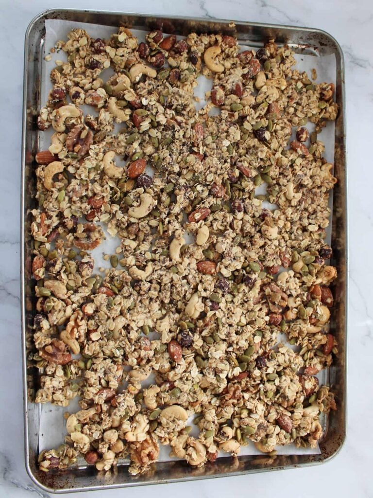 Sourdough granola on a sheet pan after baking.