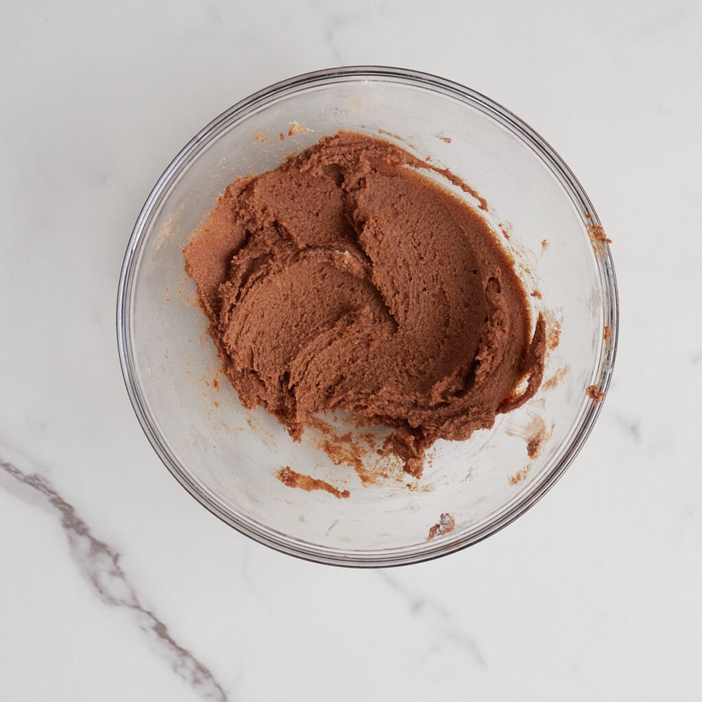 Spiced butter filling mixed together in a clear bowl for Carrot Cake Sourdough Bread.