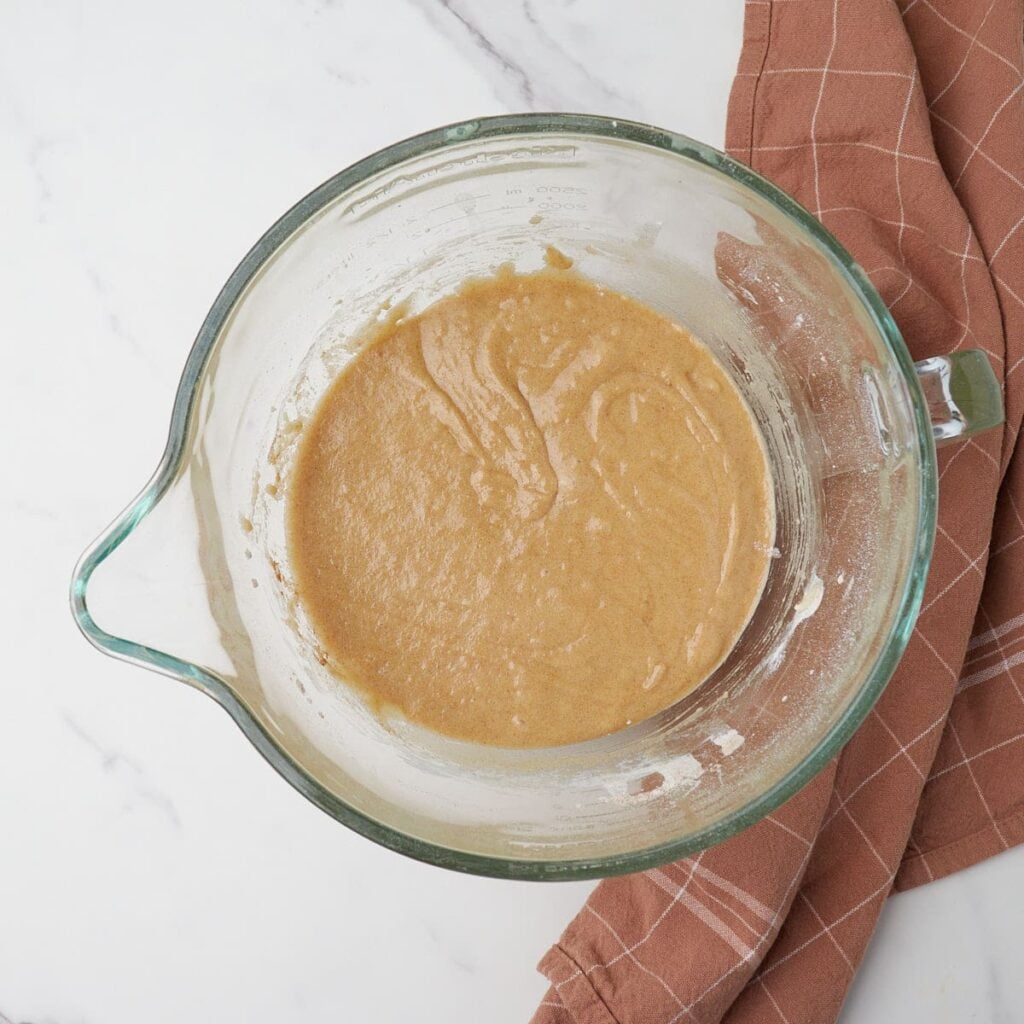 Dry ingredients added to batter for sourdough carrot cake.