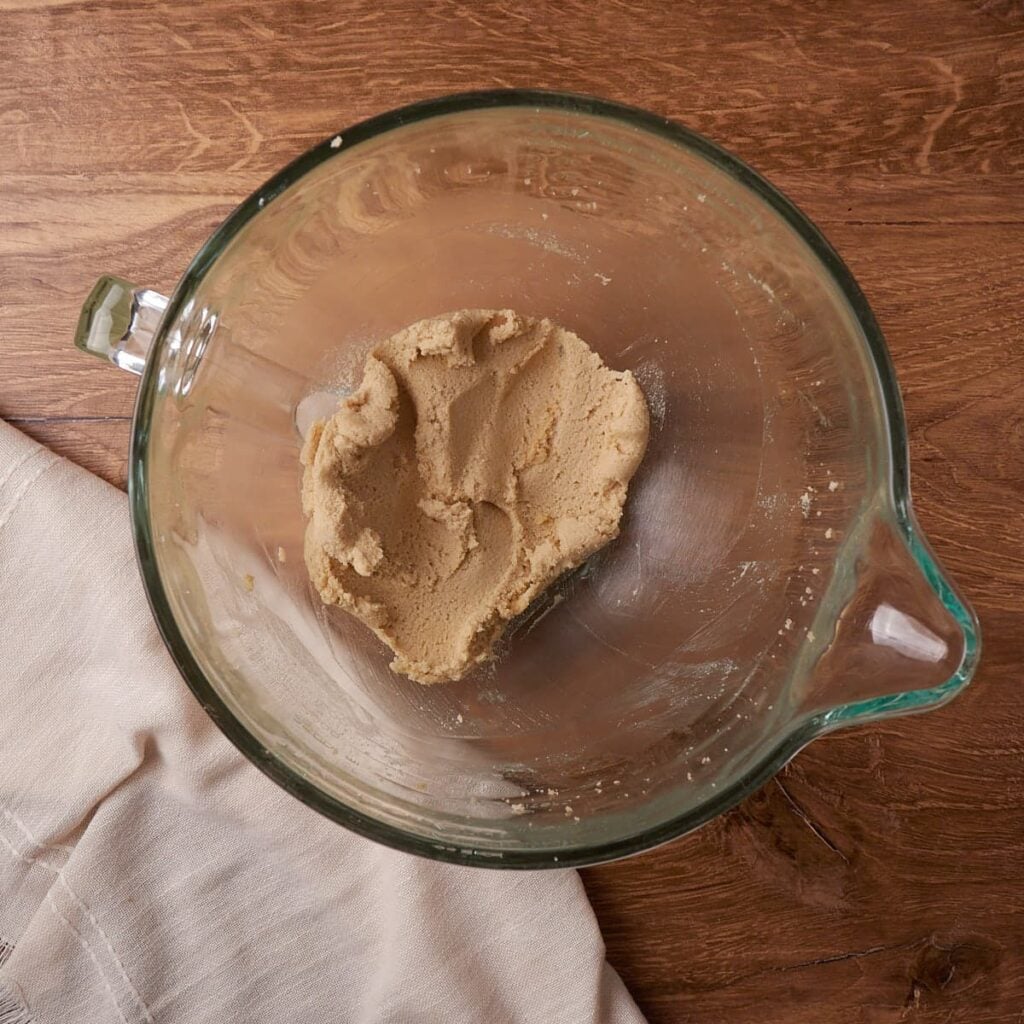 Butter and sugars creamed together in a clear bowl for Sourdough Chocolate Banana Bread.