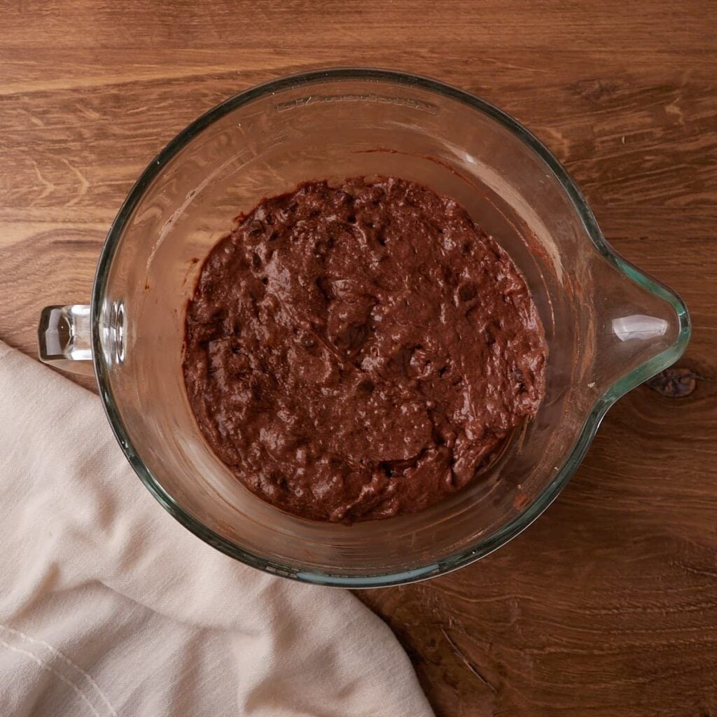 Dry ingredients added to wet ingredients for Sourdough Chocolate Banana Bread.