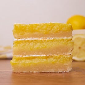 Three sourdough lemon bars stacked on top of each other.