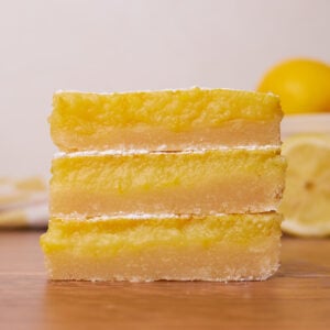 Three sourdough lemon bars stacked on top of each other.