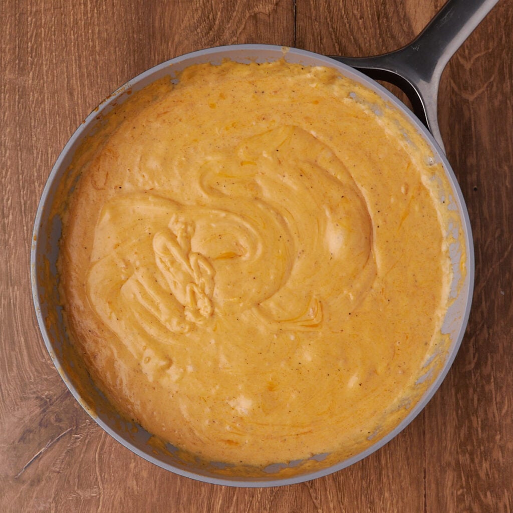 Cheese sauce for sourdough mac and cheese in a pot.