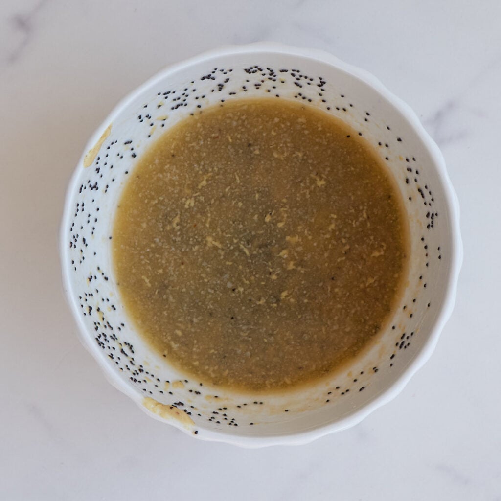 Savory topping for Sourdough Ham and Cheese Rolls mixed in a white bowl.
