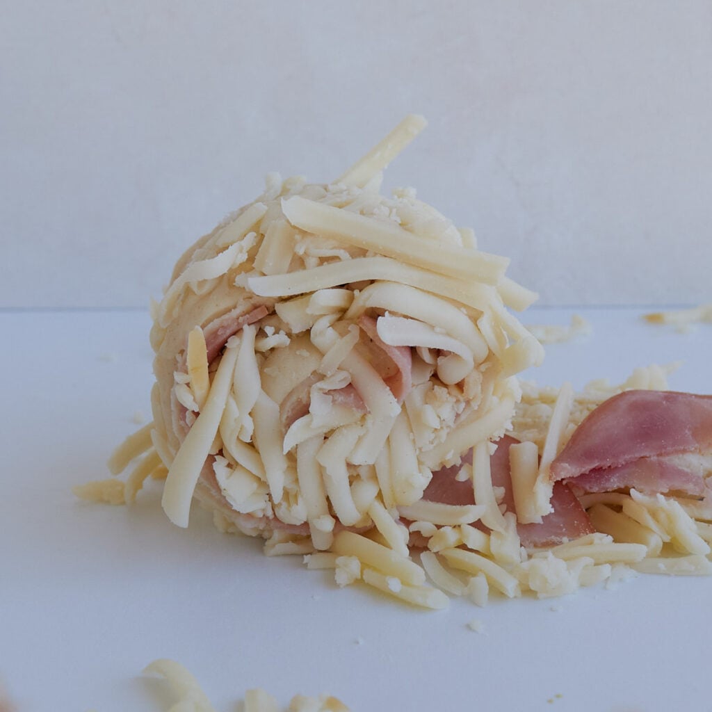 Dough for Sourdough Ham and Cheese Rolls rolled up.