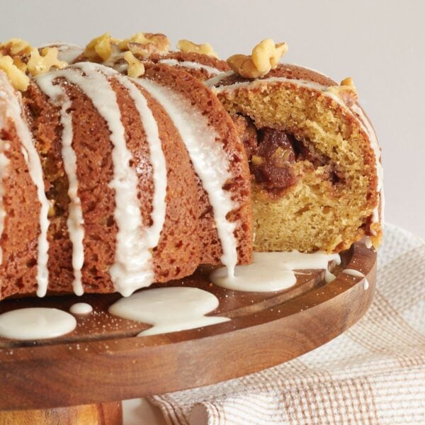 Sourdough Coffee Cake on a cake stand with a slice taken out.