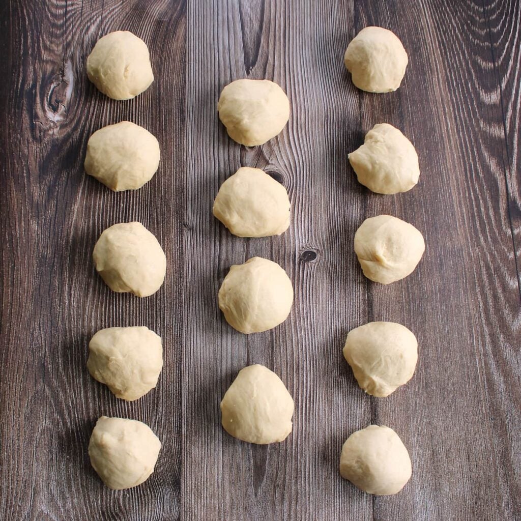 Dough for sourdough discard hot dog buns divided into 14 dough balls.