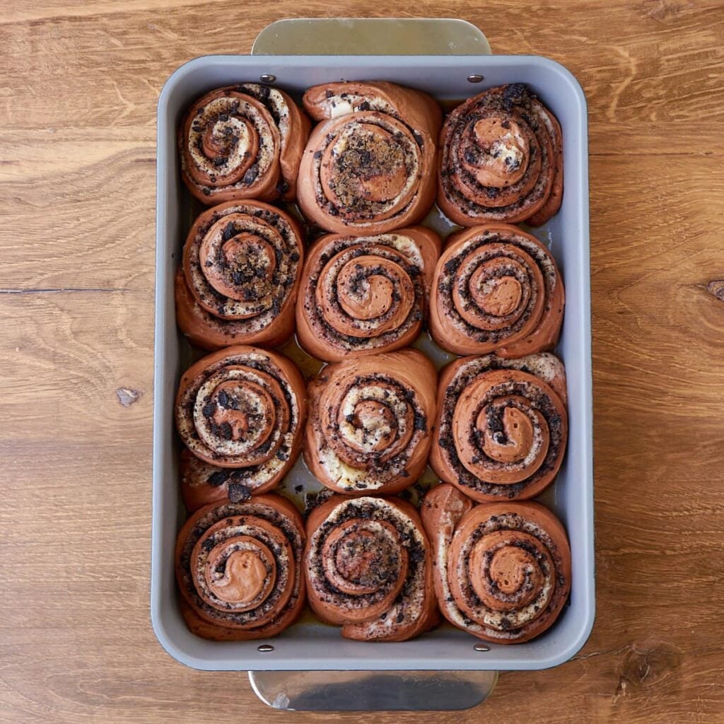 Cookies and Cream Sourdough Chocolate Rolls in a 9x13 pan after the second rise.