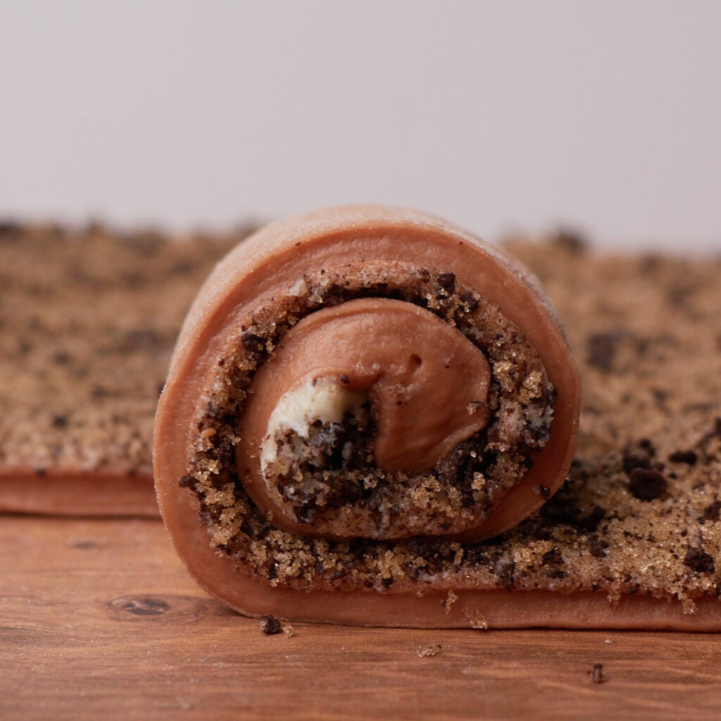 One strip of dough for Cookies and Cream Sourdough Chocolate Rolls rolled up.