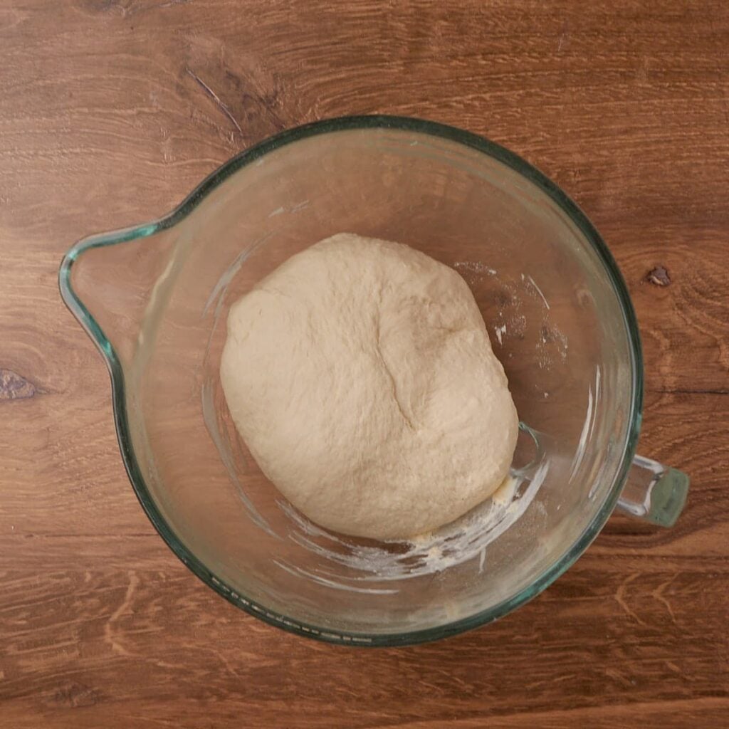 Sourdough Discard Pizza Dough in a clear bowl before rising.
