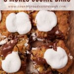 Sourdough S'more Cookie Bars cut into squares on a wooden surface.