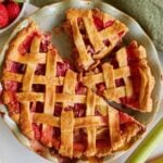 Sourdough Strawberry Rhubarb Pie cut into slices in a pie pan.