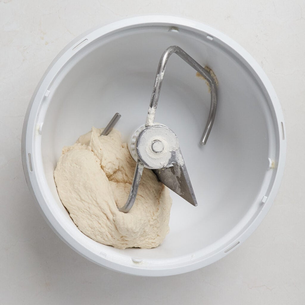 Dough for sourdough discard bagels in a mixer.