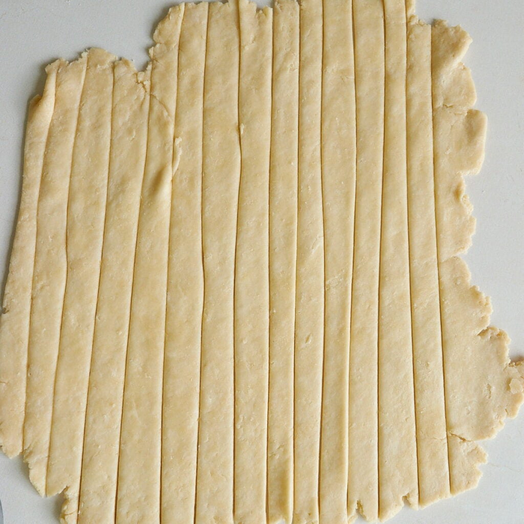 Sourdough pie dough cut into thin strips to make a lattice crust.
