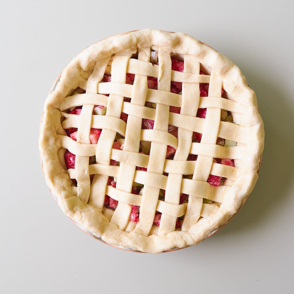 Sourdough pie dough with a lattice top crust and strawberry rhubarb filling.