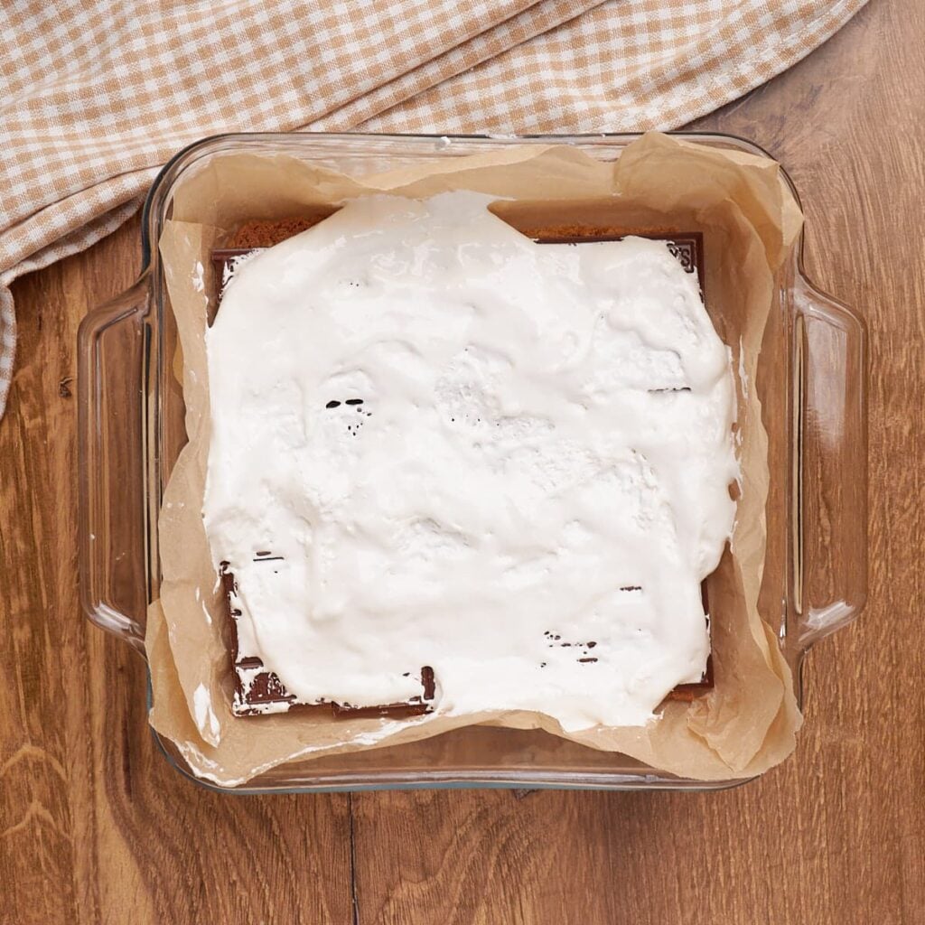 Marshmallow fluff layer added to the Sourdough S'mores Cookie Bars in an 8x8 pan.