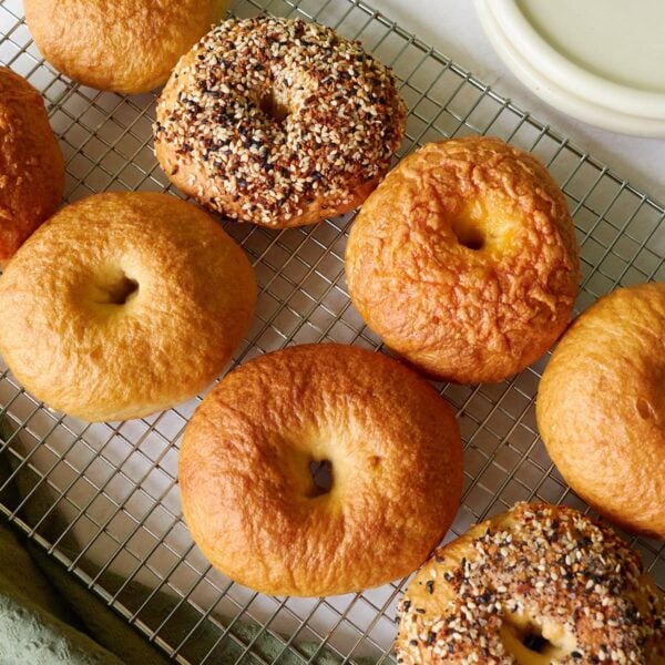 Sourdough discard bagels on a wire cooling rack.