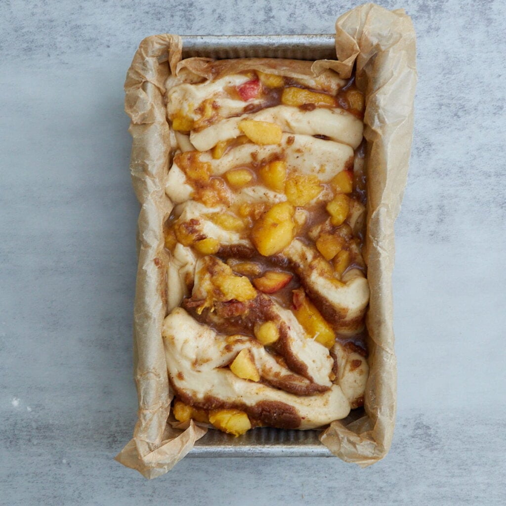 Sourdough Peach Pull-Apart Bread in a loaf pan after the second rise.