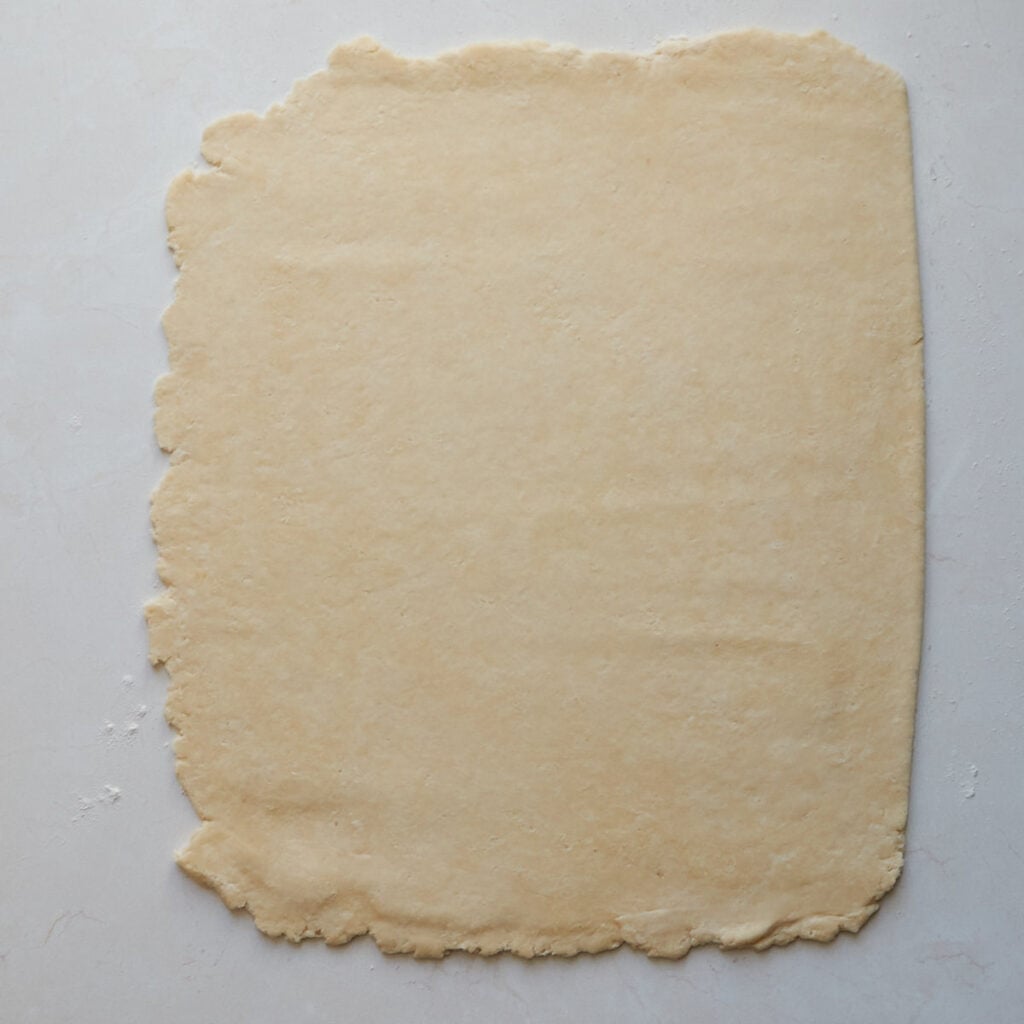 Dough for sourdough pop tarts rolled out into a 12x16-inch rectangle.
