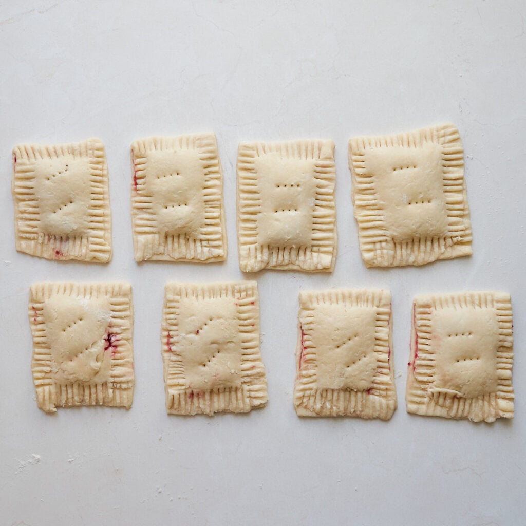 8 sourdough pop tarts with the edges crimped and holes poked in the top to vent.