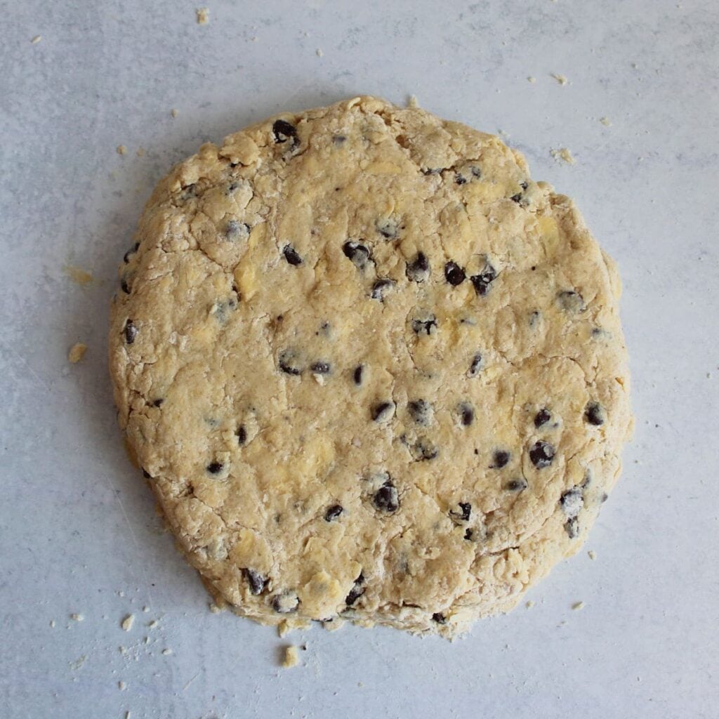 Sourdough scone dough formed into an 8 inch disk.