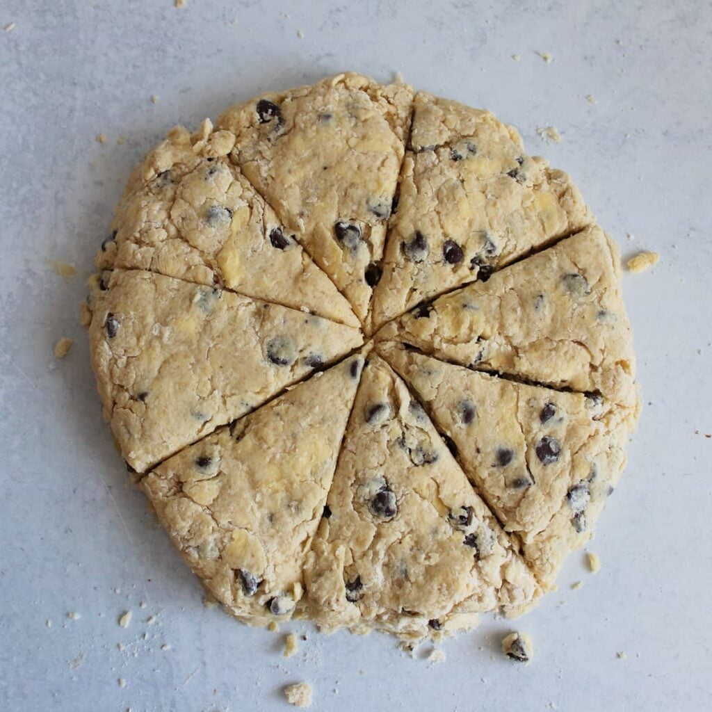 Wedges cut into the Chocolate Chip Sourdough Scone dough.