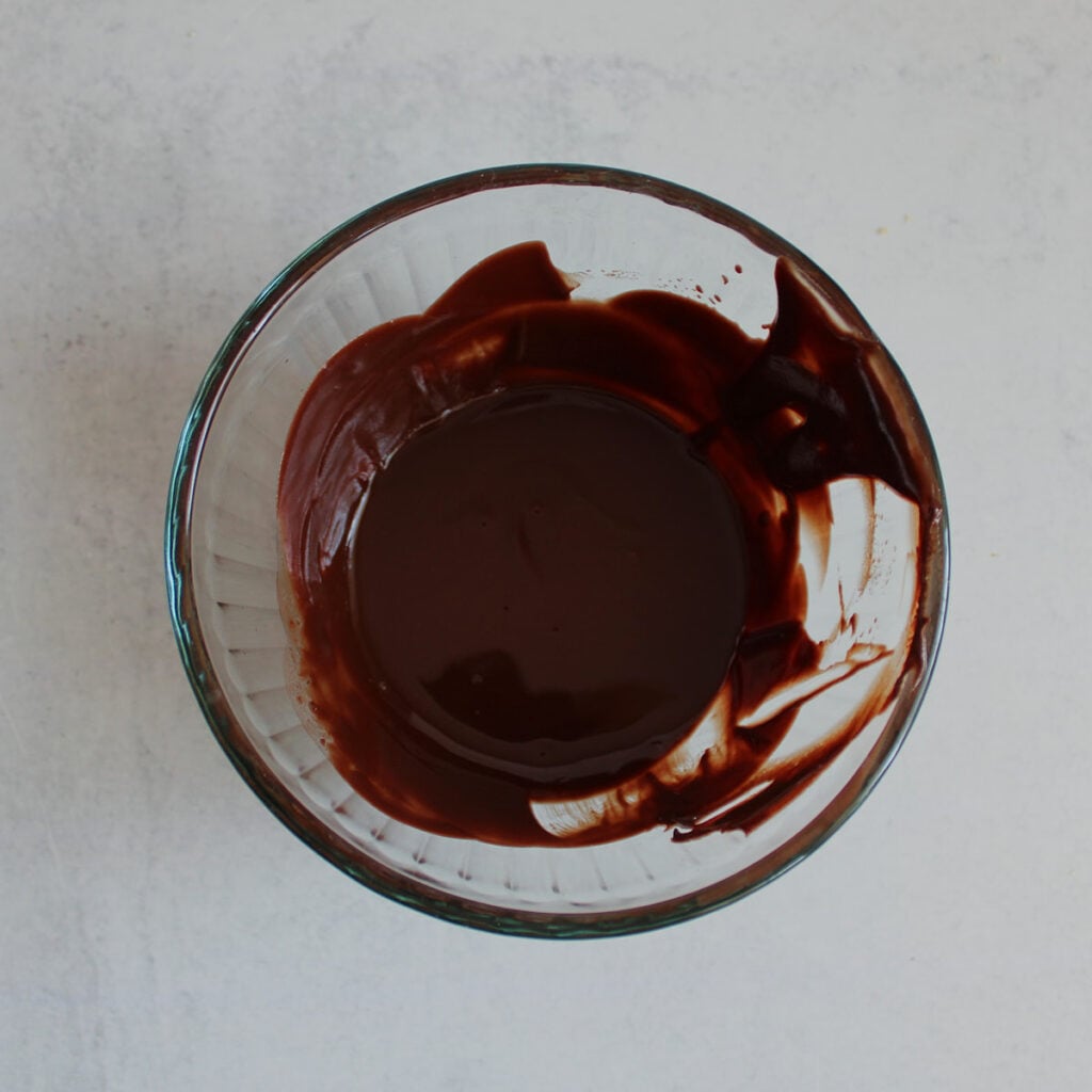 Chocolate chips and butter melted together to create chocolate drizzle.