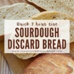 Three slices of sourdough discard bread on a cutting board next to half a loaf.