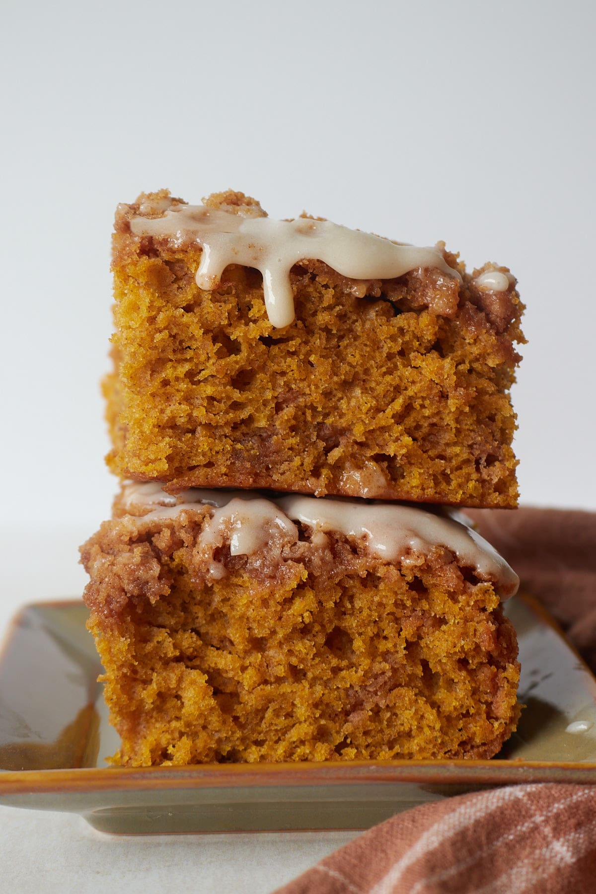 Two slices of sourdough pumpkin coffee cake stacked on top of each other.