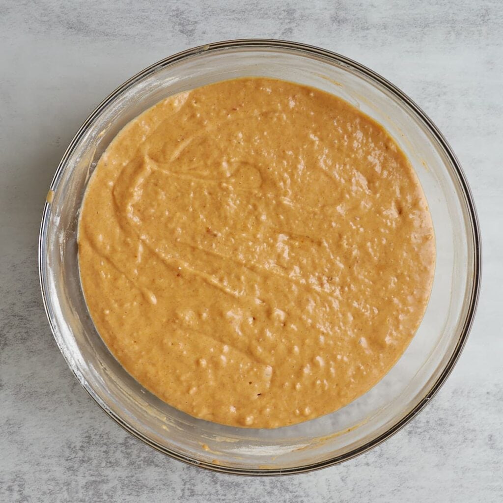 Dry ingredients added to batter for sourdough pumpkin coffee cake.