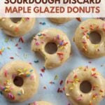Baked Sourdough Maple Glazed Donuts with sprinkles on top.