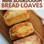 4 Sourdough Mini Bread Loaves on a wooden board.