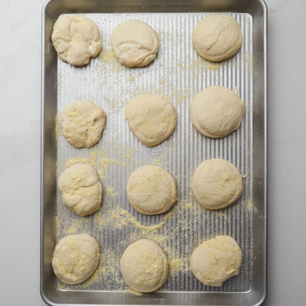 Sourdough English Muffins on a sheet pan for second rise.