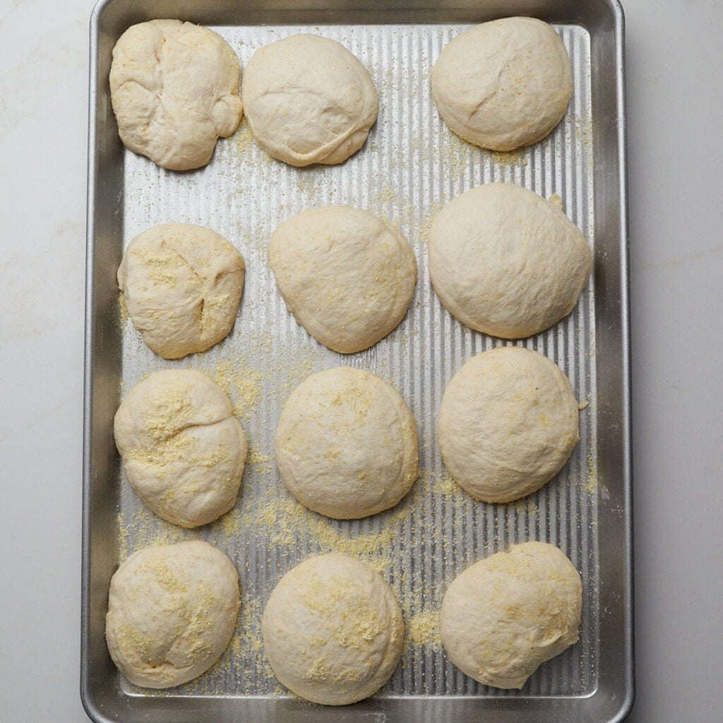 Sourdough English Muffins after second rise on a sheet pan.
